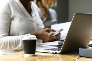 Woman Sitting and Working at Computer