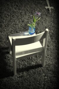 Empty Chair with Flower